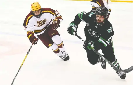  ?? RUSS HONS/UND ATHLETICS FILES ?? After captaining the NCAA’S University of North Dakota Fighting Hawks for the past two seasons, defenceman Colton Poolman, right, has signed with the Calgary Flames.