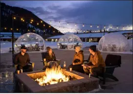  ?? PROVIDED BY AARON KRAFT VIA THE NEW YORK TIMES ?? Guests at the Virginian Lodge in Jackson, Wyo. At this motor lodge dating to the 1960s, 165 retro- style rooms, 20 suites, pop- up igloos, fire pits and an all- season pool await guests looking for affordable lodgings.