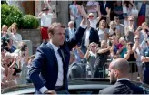  ?? — AP ?? French President Emmanuel Macron waves to the crowd as he leaves a polling station in Le Touquet, northern France, on Sunday after casting his vote in the first round of the legislativ­e elections.