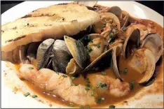  ?? Arkansas Democrat-Gazette/JENNIFER CHRISTMAN ?? Ira’s Restaurant’s Cioppino features shellfish and whitefish in a tomato fennel broth.