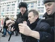 ?? Evgeny Feldman The campaign of Alexei Navalny ?? POLICE detain whistle-blower Alexei Navalny in Moscow. Tens of thousands protested across Russia.
