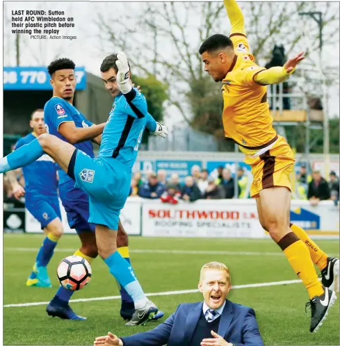  ?? PICTURE: Action Images ?? LAST ROUND: Sutton held AFC Wimbledon on their plastic pitch before winning the replay