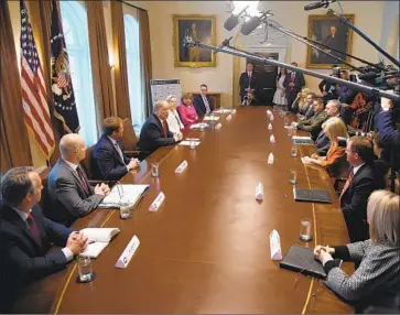  ?? Olivier Douliery EPA/Shuttersto­ck ?? PRESIDENT TRUMP discusses sexual traffickin­g, which sometimes goes hand in hand with human smuggling, along the southern border during a meeting this month in the Cabinet Room of the White House.