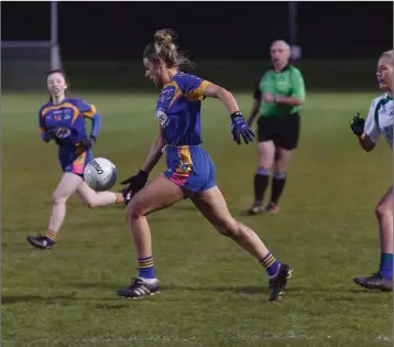  ??  ?? Carnew’s Mary Collins powers towards the AGB goal during the Junior ‘A’ football semi-final.