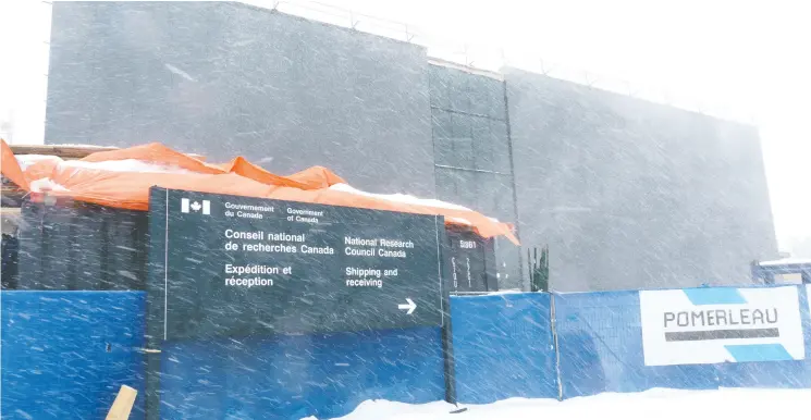  ?? PAUL CHIASSON / THE CANADIAN PRESS ?? The new National Research Council facility in Montreal on Tuesday which will begin producing Novavax doses of COVID-19 vaccine when the building is finished this year.