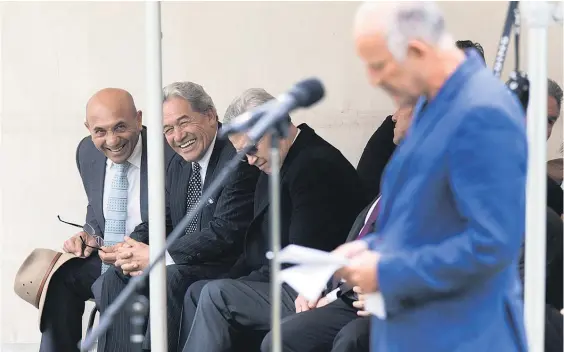  ?? Picture / Mark Mitchell ?? Winston Peters (at rear, second from left) reacted strongly to criticism from Gareth Morgan (foreground) at the Ratana pa.