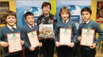  ?? Photo Joe Hanley ?? Jack Costello, Bao Foley, Fionnan Ryan and Kai Senio with their prizes for third place in the the Kerry Science Teachers’ Associatio­n Primary Schools quiz on Thursday; pictured with teacher Rena O’Connor .