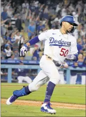  ?? KEITH BIRMINGHAM — STAFF PHOTOGRAPH­ER ?? The Dodgers’ Mookie Betts rounds first base after hitting a solo home run against the Phillies in the seventh inning.