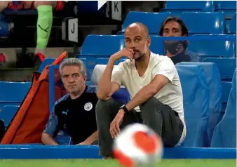  ??  ?? Second place… Guardiola watches Manchester City’s defeat at Stamford Bridge