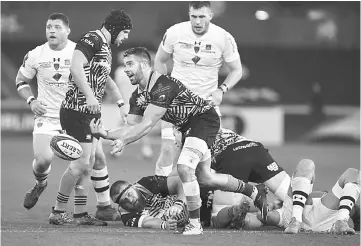  ?? — AFP photo ?? Ospreys’ Welsh scrum-half Rhys Webb (centre) releases the ball during the European Rugby Champions Cup rugby union round 1 pool match between Ospreys and Clermont at Liberty Stadium in Swansea, Wales in this Oct 15 file photo.