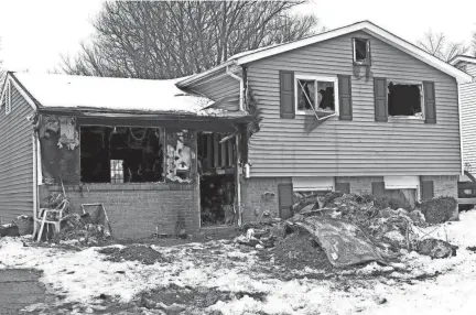  ?? FRED SQUILLANTE/COLUMBUS DISPATCH ?? Debris litters the scene of a fatal house fire on Glenshaw Avenue that killed a 4-year-old boy over the weekend. A neighbor has started an effort to raise money to help the family.