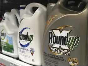  ?? AP PHOTO/HAVEN DALEY ?? In this Feb. 24, file photo, containers of Roundup are displayed on a store shelf in San Francisco.