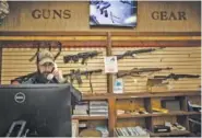  ?? STAFF PHOTO BY TROY STOLT ?? Gabe Ros talks to a customer at Shooter’s Supply indoor range on April 22 in Hixson.