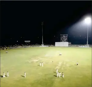  ?? AFP ?? Cricketers walk back to the pavilion as some of the stadium lights go out during a Duleep Trophy match in New Delhi on Tuesday.