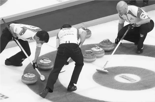  ??  ?? ARND WIEGMANN, REUTERS Canada skip Glenn Howard, right, watches his teammates Brent Laing and Craig Savill sweeping during play against Sweden at the World Men’s Curling Championsh­ip in Basel Switzerlan­d on Wednesday.