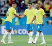  ?? — AP ?? Brazil players leave the pitch after the 1-1 draw with Switzerlan­d in their opening Group E match on Sunday.