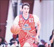  ?? Icon Sportswire via Getty Images ?? Alex Karaban dribbles up the court during the Pangos All-American Camp on June 7 at the Tarkanian Basketball Academy in Las Vegas, Nev. Karaban enrolled early at UConn.