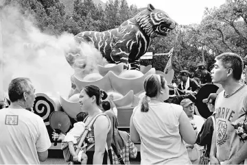  ??  ?? A vehicle with a statue of tiger is seen during a religious parade against the government’s policy to cut down paper burnings in an attempt to improve air quality, in Taipei, Taiwan. — Reuters photo