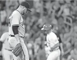  ?? AP ?? Diamondbac­ks relief pitcher Alex Young, left, reacts as the Cardinals’ Paul DeJong hits a two-run homer in the seventh inning Monday in St. Louis.