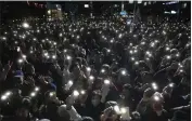  ?? LEE JIN-MAN — THE ASSOCIATED PRESS ?? Supporters of South Korea's ruling People Power Party flash their smartphone­s' lights during the party's parliament­ary election campaign in Seoul, South Korea, Tuesday.