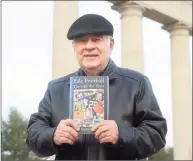  ?? Ned Gerard / Hearst Connecticu­t Media ?? Author Rich Marazzi of Ansonia with a copy of his new book, “Yale Football Through the Years,” in front of the Walter Camp Memorial, adjacent to Yale Bowl in New Haven on Dec. 11.