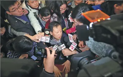  ?? ZOU HONG / CHINA DAILY ?? Jiang Yang, vice-chairman of the China Securities Regulatory Commission, answers reporters’ queries after a panel discussion of the ongoing annual session of the 13th National Committee of the CPPCC.