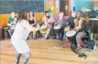  ??  ?? Drum teacher Koffie Fugah and the group supply the rhythm for dance teacher Jenny Bloomfield.