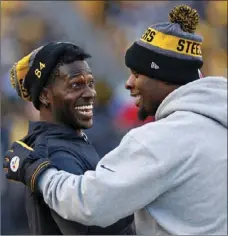  ??  ?? This Jan. 1 photo shows Pittsburgh Steelers wide receiver Antonio Brown (left) and running back Le'Veon Bell celebratin­g on the sideline after a Steelers touchdown. AP PHOTO