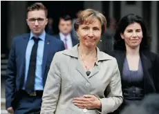  ?? NIKLAS HALLE’N/AFP/GETTY IMAGES ?? Marina Litvinenko, centre, widow of Russian former spy Alexander Litvinenko, and her son Anatoly Litvinenko, left, leave the Royal Courts of Justice in central London on Friday.