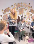  ??  ?? Rachel Geller talks with volunteers who have gathered near Boston to learn more about cat behavior. TOP: Treats’ owner was on the verge of finding him a new home when Geller intervened, offering strategies for dealing with the biting, scratching and...