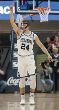  ?? LAURENCE KESTERSON — THE ASSOCIATED PRESS ?? Villanova guard Joe Cremo gestures after making a 3-pointer during the first half against Saint Joseph’s Saturday. Cremo scored 12 first-half points, part of his growing contributi­on off the bench, in a 70-58 win.