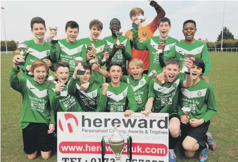  ??  ?? Leo Da Silva Lopes (back row centre) celebrates a cup win with Powerleagu­e Under 14s.