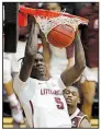  ?? Arkansas Democrat-Gazette/ THOMAS METTHE ?? UALR’s Oliver Black dunks to tie the game at 70-70 on Saturday, but Texas State responded to win 72-70.