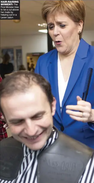  ??  ?? HAIR-RAISING
MOMENT: The First Minister tries to be a cut above her rivals by helping out in a Leven salon