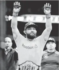  ?? MATT STRASEN, AP ?? Johny Hendricks, above, beat Robbie Lawler by unanimous decision to win the welterweig­ht title in UFC 171 on Saturday.