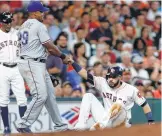  ?? Karen Warren / Houston Chronicle ?? Adrian Beltre may be willing to give Marwin Gonzalez a helping hand, but the rivalry with the Rangers is becoming more intense, thanks to the Astros’ move to the AL.