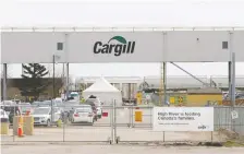  ?? TODD KOROL/REUTERS ?? Farmers are struggling with animal backlogs following virus outbreaks at plants, including a major one at Cargill, above.