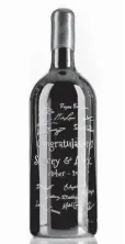  ?? Justin Griffin/Personal Wine via AP ?? A 3L size bottle of Cabernet Sauvignon is used as a guest book for a wedding in Austin. After the attendees signed the bottle, it was engraved and painted over on the signatures to preserve it.