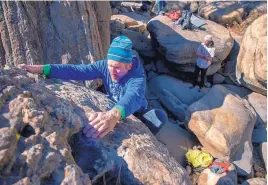  ??  ?? William Penner, from Albuquerqu­e, who was among the Canyon, climbs a rock last week. first boulderers in Mills