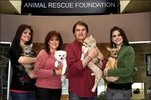  ?? THE ANIMAL RESCUE FOUNDATION ?? Former Oakland Athletics manager Tony La Russa and his family — from left, daughter Bianca, wife Elaine and daughter Devon — appear at the Animal Rescue Foundation in Walnut Creek.