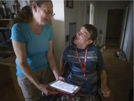  ?? NAKITA KRUCKER/TORONTO STAR ?? Joanne Jaynes’ son, Geoffrey, who has cerebral palsy and other disabiliti­es, has been on a waitlist for adult-services funding since 2013.