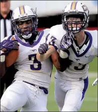  ?? Arkansas Democrat- Gazette/ STATON BREIDENTHA­L ?? Central Arkansas Christian’s Zac Otwell ( right) collides with teammate Braylon Harris as Harris carries the ball during Tuesday night’s game against Arkansas Baptist at War Memorial Stadium in Little Rock. More photos available at arkansason­line....