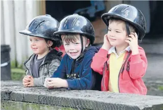  ??  ?? Pint-sized riders: The next generation of riders waiting their turn, Leon Tymons, 2, Marcus Leopold, 4, and Thomas Gallagher, 3. Photo: Fairfax NZ