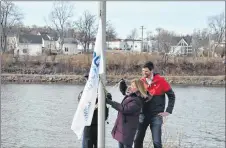  ?? SYMONNE OUTHOUSE/THE NEWS ?? New Glasgow Mayor Nancy Dicks and Central Nova MP Sean Fraser raise the official flag marking Autism Awareness Day on April 2. The flag raising was the precursor to the official opening of the local Autism Resource Centre at Glasgow Square.