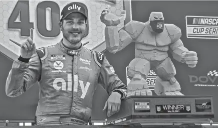  ?? AP ?? Alex Bowman celebrates after winning the NASCAR Cup Series race at Dover Internatio­nal Speedway last year.