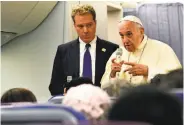  ?? Vincenzo Pinto / AFP / Getty Images ?? Pope Francis holds a news conference on board his jetliner after a seven-day trip to Chile and Peru.