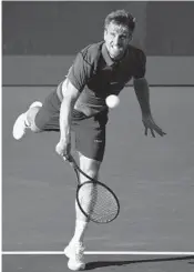  ?? JIM RASSOL/STAFF PHOTOGRAPH­ER ?? Peter Gojowczyk serves against Steve Johnson on Saturday. He plays today in the final of the Delray Beach Open.