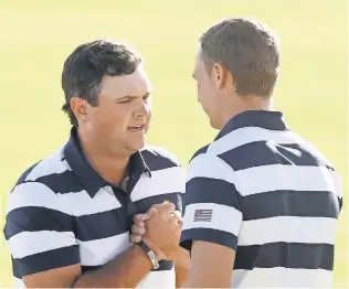  ?? SAM GREENWOOD, GETTY IMAGES ?? Patrick Reed, left, and Jordan Spieth defeated Emiliano Grillo and Si Woo Kim 5 and 4.