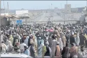  ?? JAFAR KHAN — THE ASSOCIATED PRESS ?? Stranded people gather to seek informatio­n from security forces about opening the border between Pakistan and Afghanista­n, which was closed by authoritie­s a few days ago, in Chaman, Pakistan, on Wednesday.