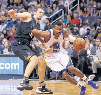  ??  ?? Warriors guard Leandro Barbosa, right, drives on Suns forward Mirza Teletovic during the second quarter.